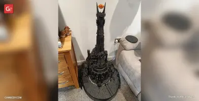 Intricate 3D model of Barad-dûr, the dark tower, with the Eye of Sauron on top, displayed indoors.