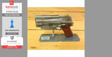 A detailed 3D-printed model of a 10mm pistol from Fallout 4, displayed on a stand.