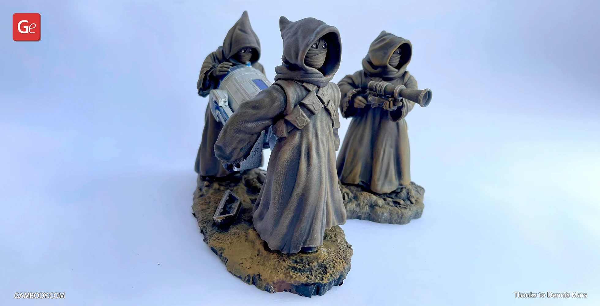 Three hooded figures holding sci-fi equipment, standing on a textured base, in a 3D-printed model.
