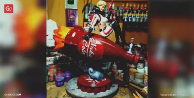 A figurine of a woman in a retro spacesuit sits on a red Nuka Cola rocket with flame details.