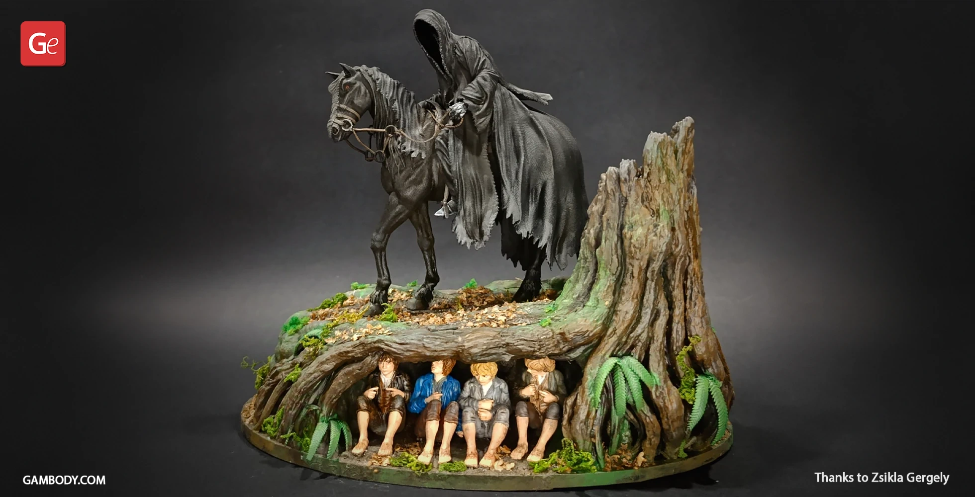 A Nazgul on horseback above four hidden Hobbits under a tree in a detailed diorama.