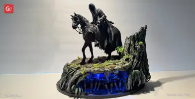 A hooded figure on horseback atop a rocky diorama with hidden, glowing figures underneath.