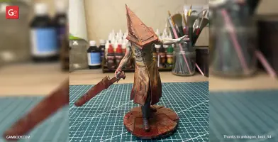 Grotesque figure with a triangular helmet, wielding a large rusty sword, standing on a textured base.