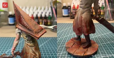 A detailed 3D model of Pyramid Head, with a large triangular helmet and blood-stained attire.