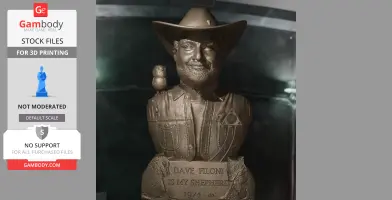 A bust of a smiling man in a cowboy hat with a small owl on his shoulder and engraved base text.
