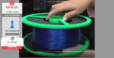 A hand holding a 3D printing filament spool with a green frame and blue filament.