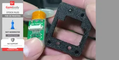 A close-up of a 3D Touch sensor and a black mounting bracket for a 3D printer.