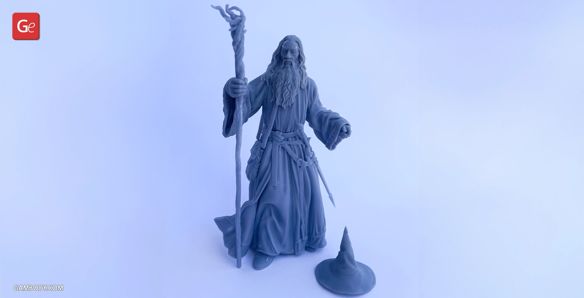 A 3D model of a wizard with a staff, long robes, and a separate pointed hat on the ground.