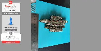Four miniature Titanic ship models on a blue surface beside a ruler for scale.