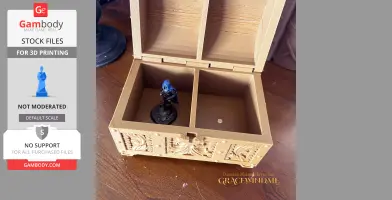 Open miniature chest with a blue-hooded figurine inside, designed for 3D printing.
