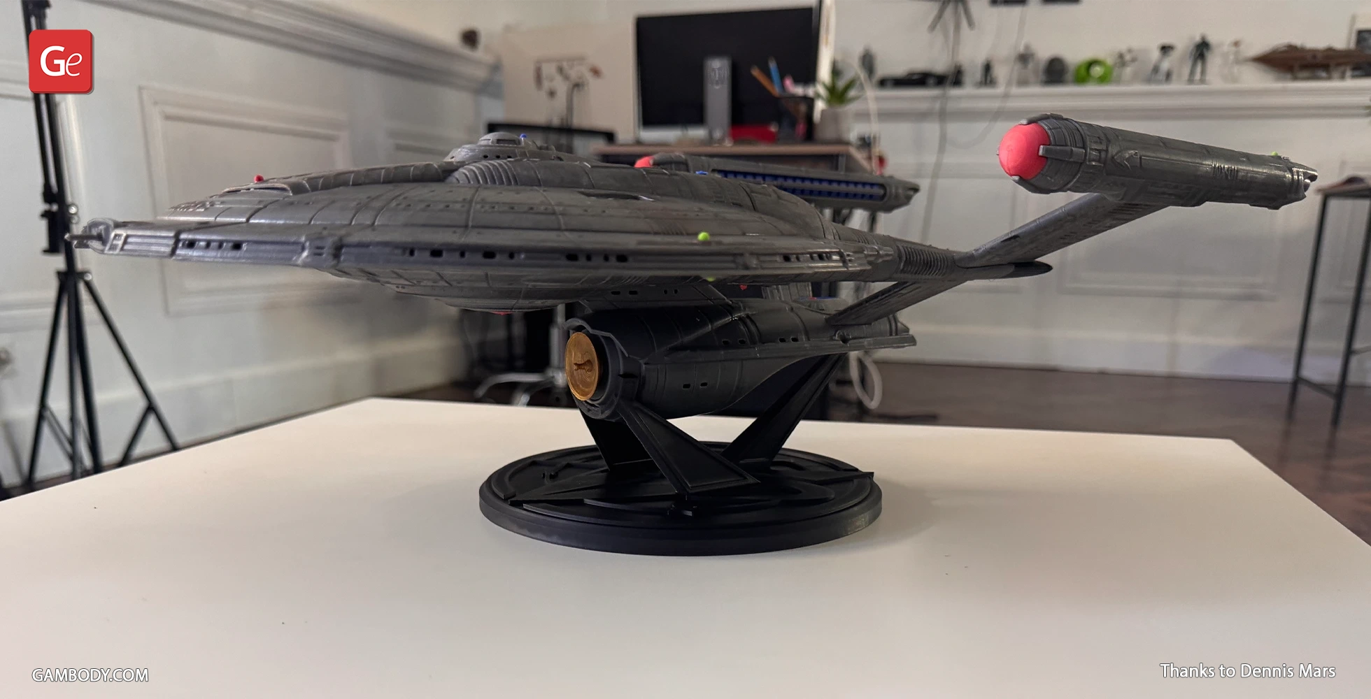 A detailed 3D-printed model of the Star Trek Enterprise NX-01 Refit on a display stand.