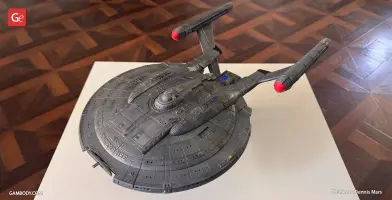A detailed 3D model of the Enterprise NX-01 Refit from Star Trek, displayed on a white surface.
