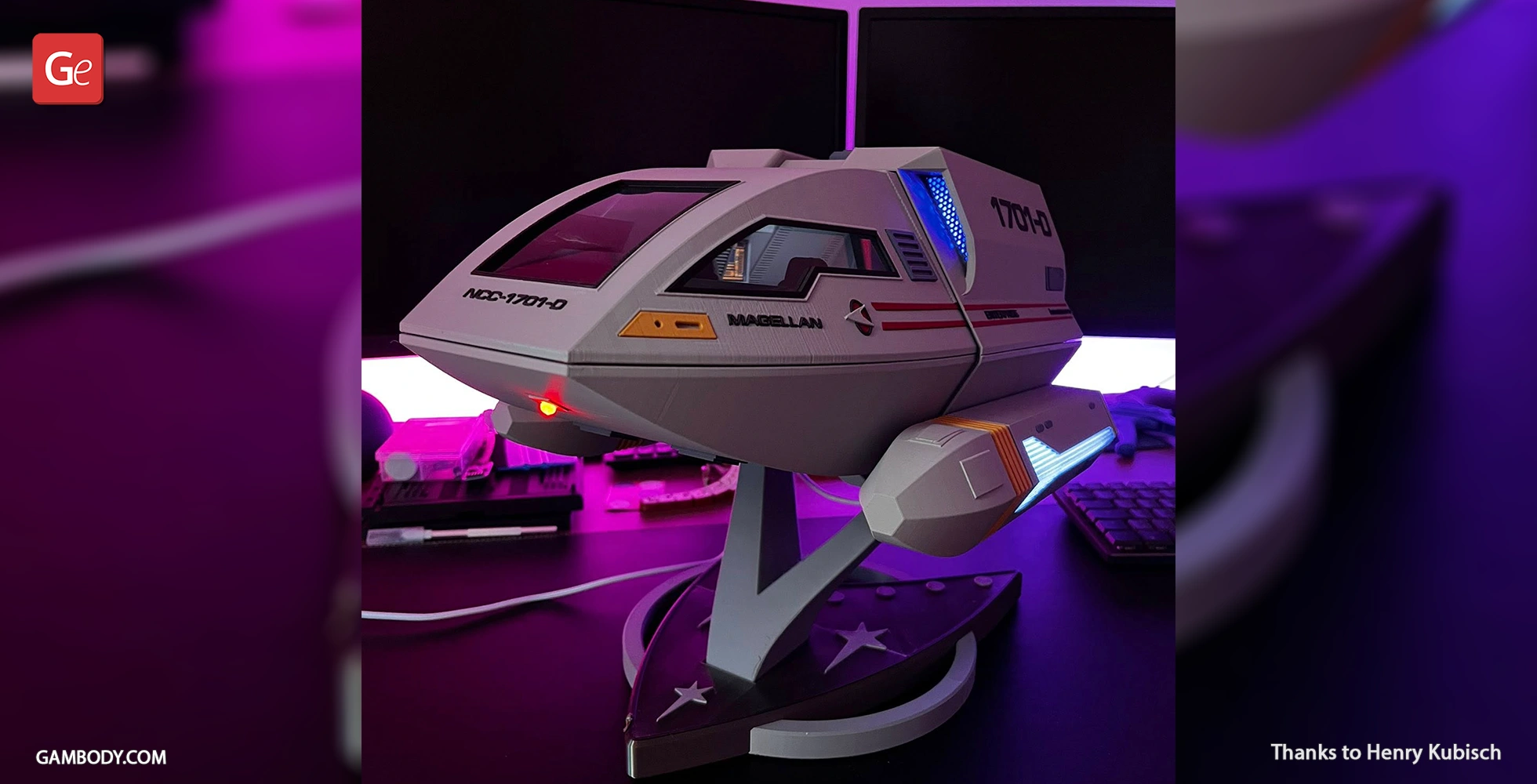 Model of Star Trek Enterprise D Shuttlecraft Type 6, mounted on a display stand with glowing lights.