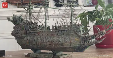 Detailed model of the Flying Dutchman ship with eerie, skeletal features on a tabletop display.