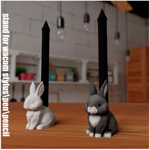 Two rabbit-shaped pen holders, one white and one gray, on a wooden table in an office setting.