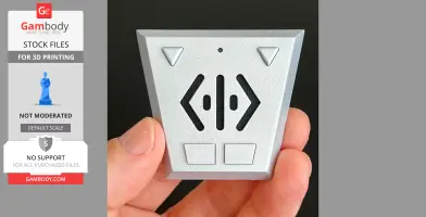 A hand holding a silver, triangular remote-like prop with buttons and arrows, inspired by Babylon 5.