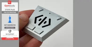 A person holding a silver, triangular Babylon 5 comm-link prop with buttons and patterns.