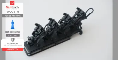 A 3D printed, scaled model of a Ghostbusters proton pack and gurney, shown in black.