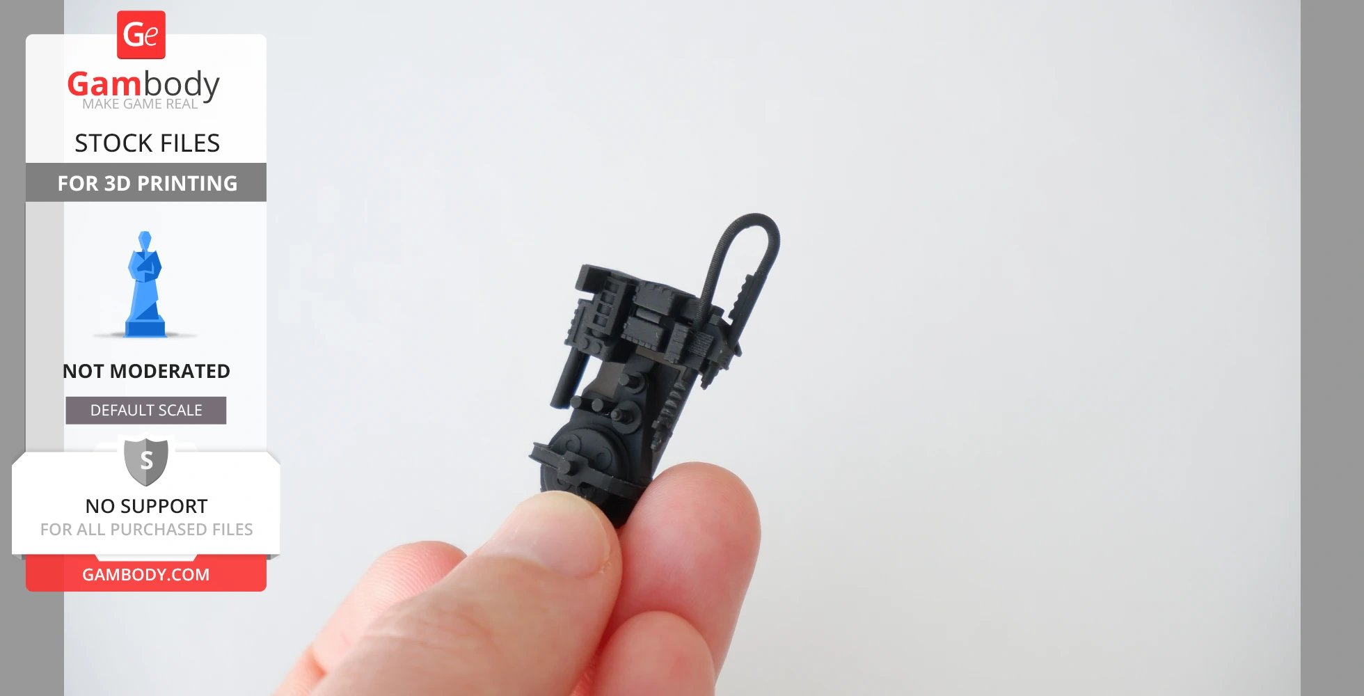 A person holds a small, detailed 3D-printed Proton Pack model in their fingers.