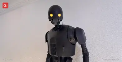 A black humanoid droid with glowing yellow eyes, inspired by K-2SO from Star Wars Rogue One.