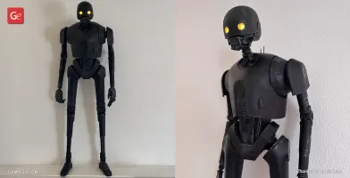 A detailed 3D-printed model of droid K-2SO from Star Wars, with glowing eyes.