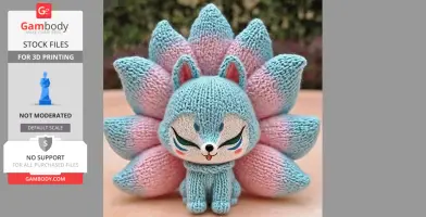 Crocheted blue and pink nine-tailed fox with closed eyes and playful expression.