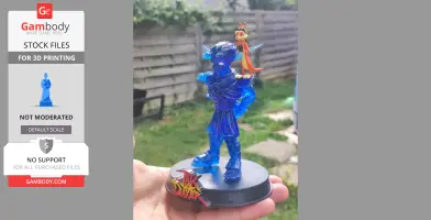 A translucent blue 3D-printed figure with a small orange creature on its shoulder, on a display base.