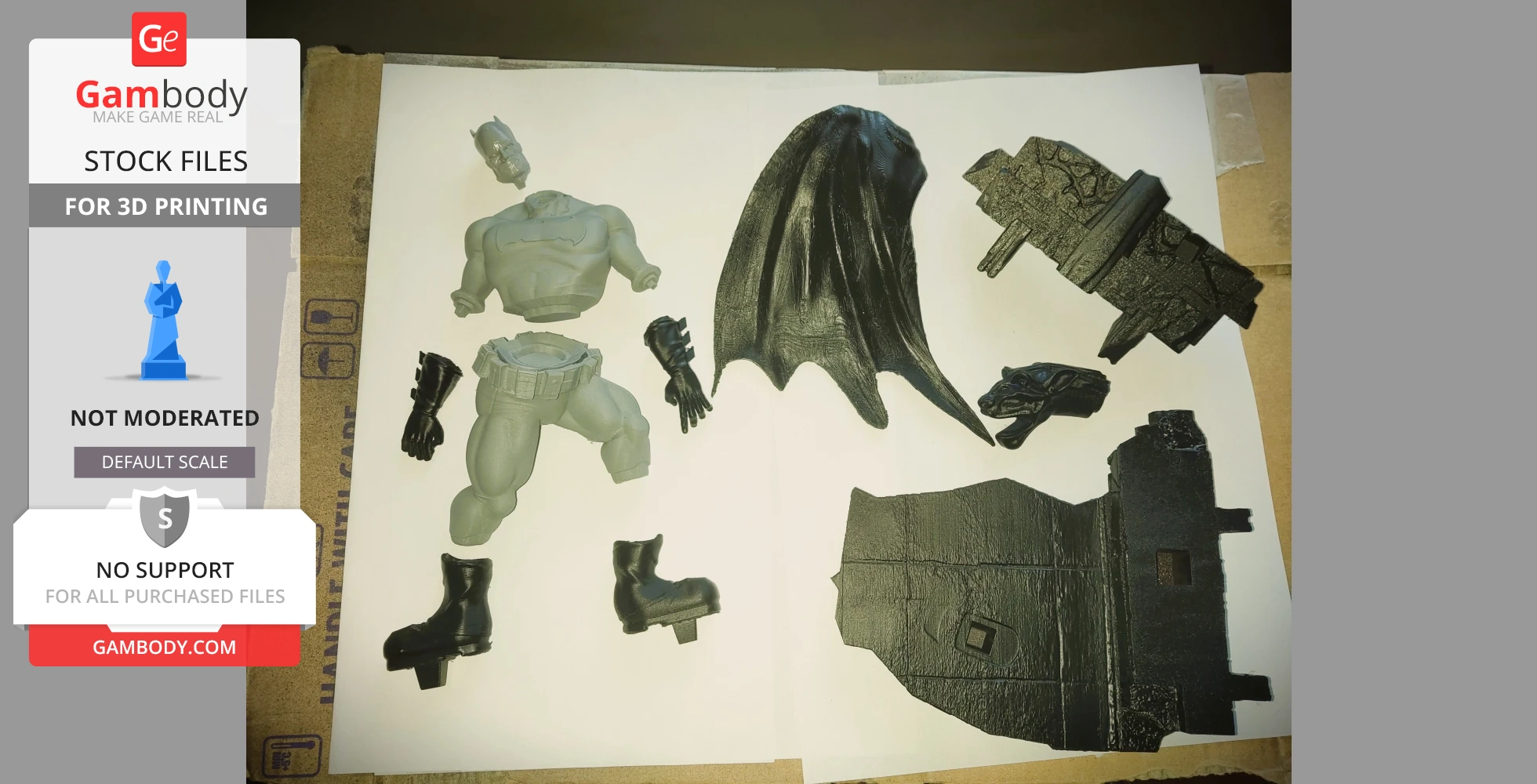 Disassembled 3D printed Batman figure pieces, including torso, legs, cape, and base on a white background.