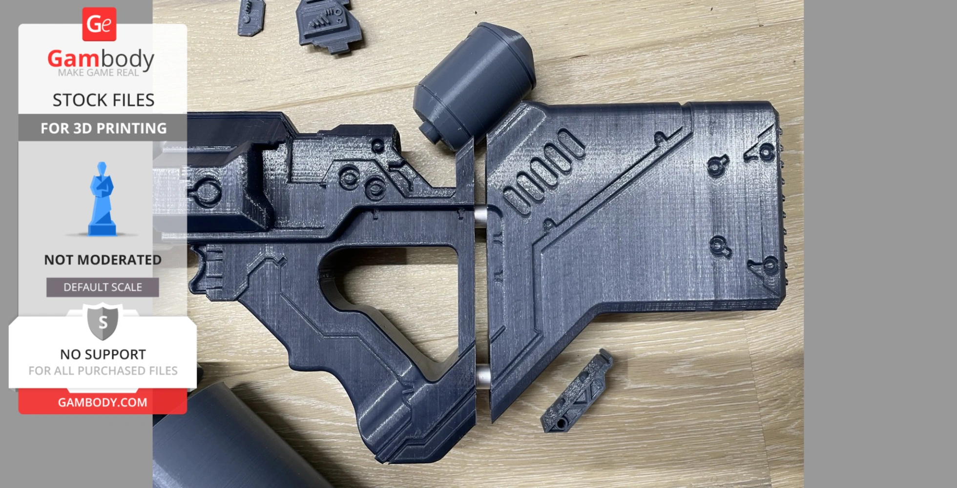 3D printed parts of a futuristic rifle replica on a wooden surface.