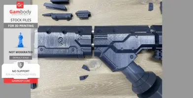 3D-printed parts of a sci-fi rifle replica from District 9, laid out for assembly.