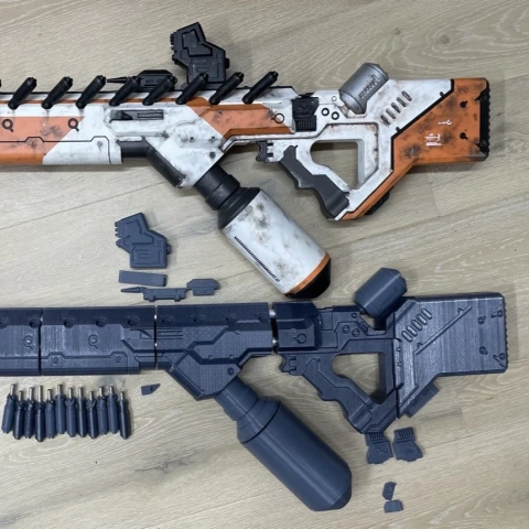 Two detailed 3D-printed rifle replicas with orange and gray accents, disassembled parts shown.