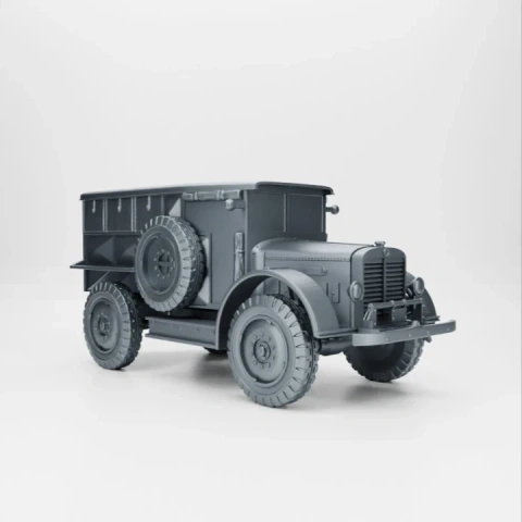3D model of a vintage military artillery tractor with a boxy rear and spare tires.