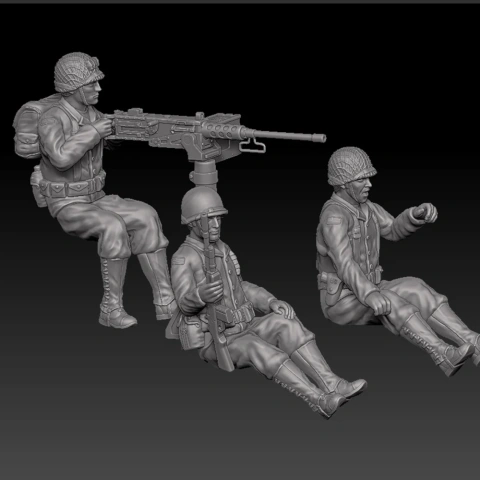 Three detailed 25mm scale WWII USA soldiers, including a gunner, in seated poses for 3D printing.