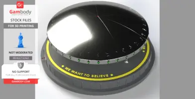 Metallic UFO model with green lights and 'We Want To Believe' text on the base, for 3D printing.