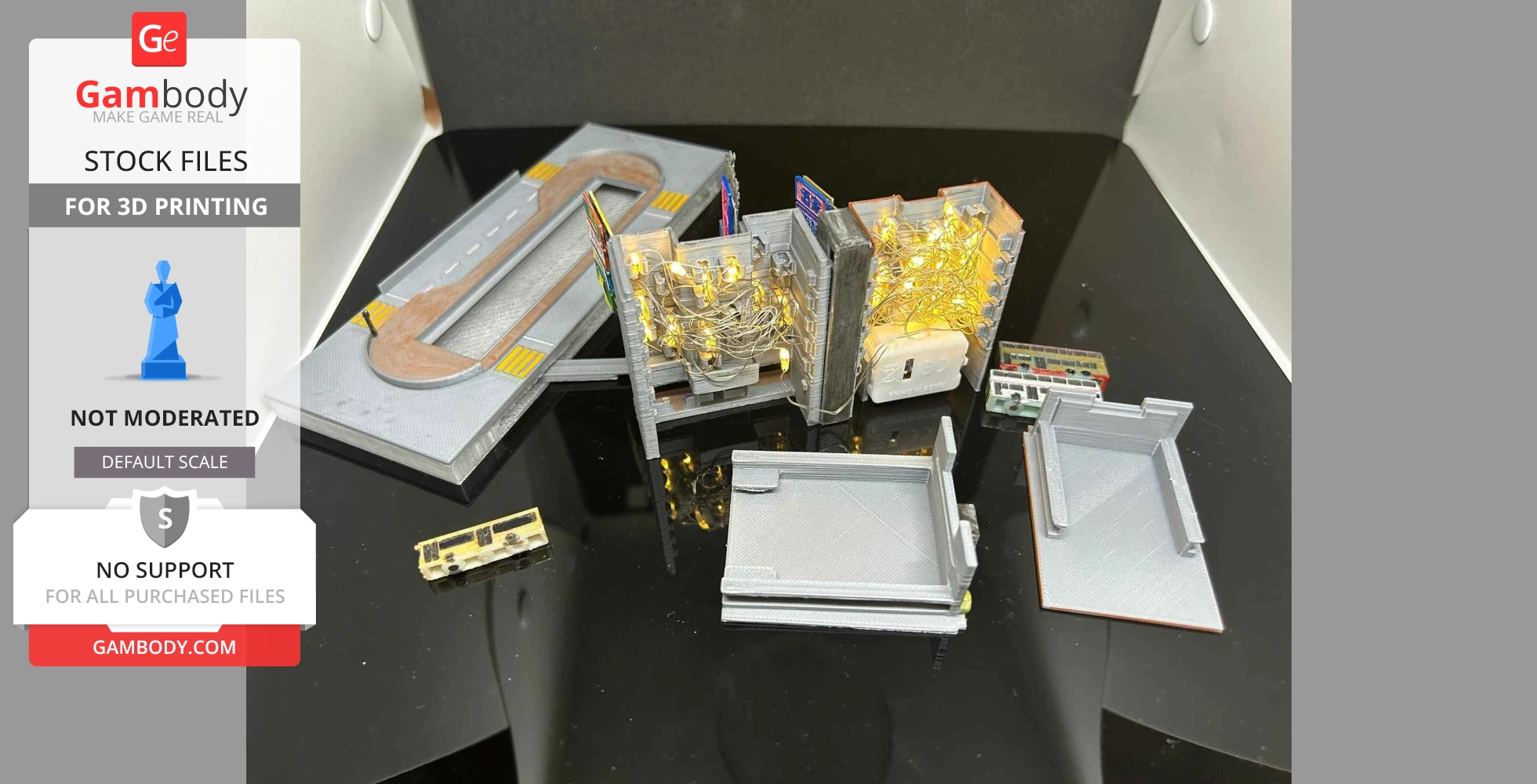 3D printed Hong Kong building set with LED lights and street details on a reflective surface.