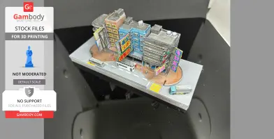 Miniature model of Hong Kong buildings with colorful signs and vehicles on a street base.