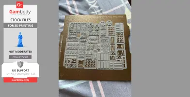 A 3D printed sheet of small, detailed Hong Kong style signs and structures for model display.