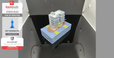 Miniature 3D model of a Hong Kong building on a base, with roads and street details.