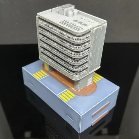 3D model of a detailed gray multi-story Hong Kong building on a blue base.