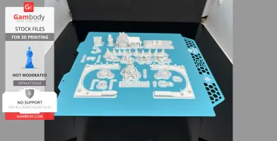 3D printed Christmas train set pieces on a blue platform, featuring trains, tracks, and festive structures.