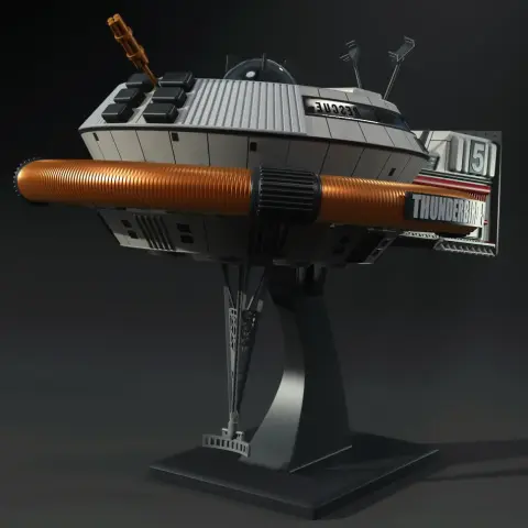 Futuristic spacecraft model with a cylindrical design, labeled 'Thunderbird 5,' on a display stand.