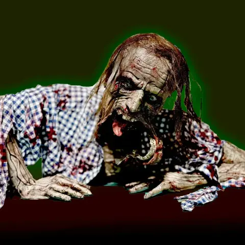 A detailed zombie model with exposed jaw, tattered clothes, and decayed appearance on a dark background.