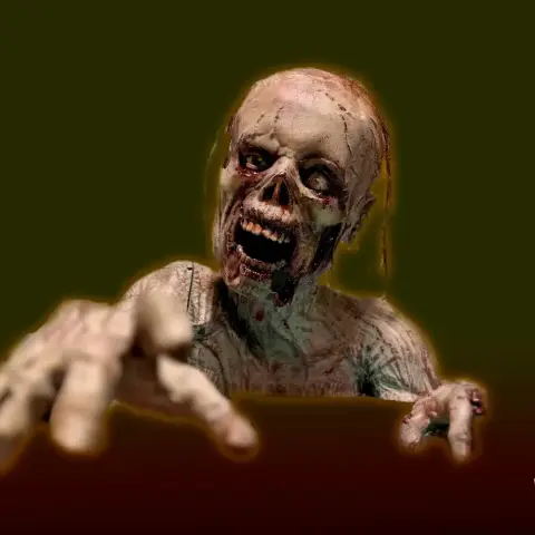 A realistic, life-sized zombie in a crawling pose, with decayed skin and outstretched hands.
