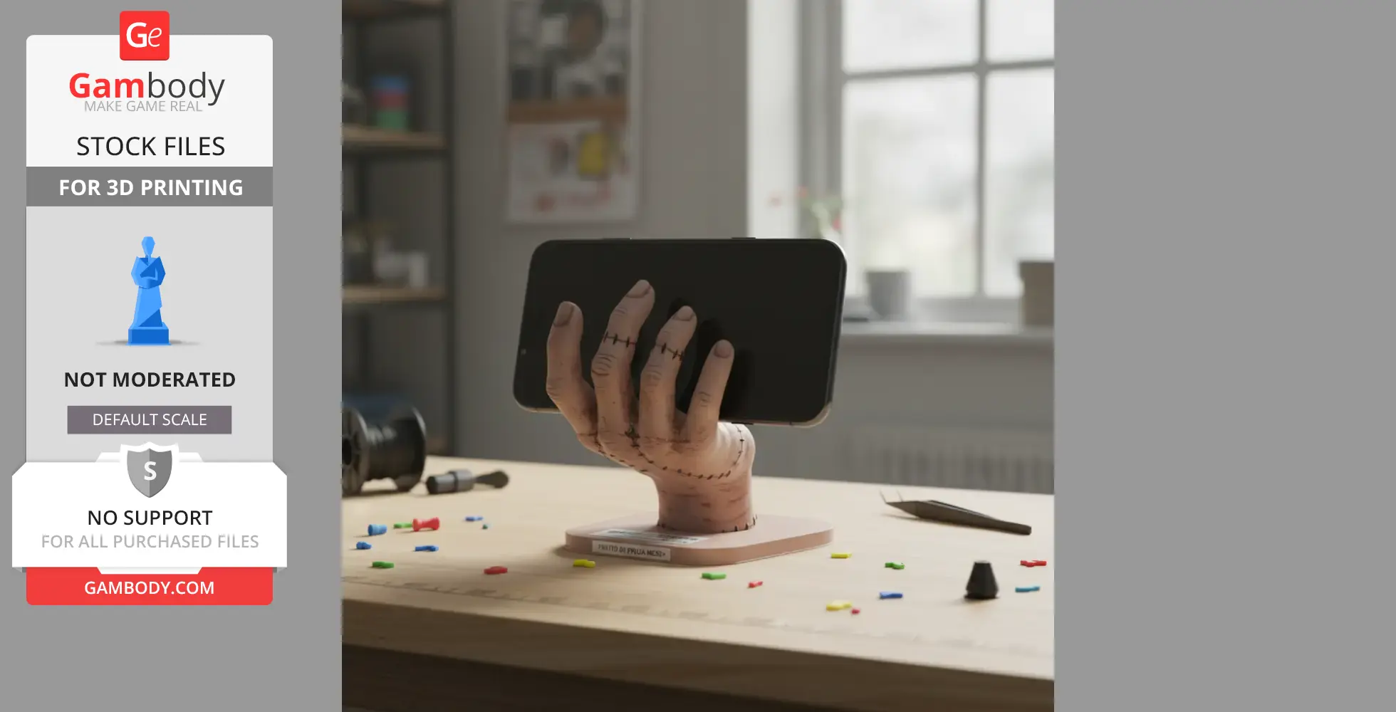 A 3D-printed hand prop holding a smartphone, displayed on a wooden table with scattered LEGO bricks.
