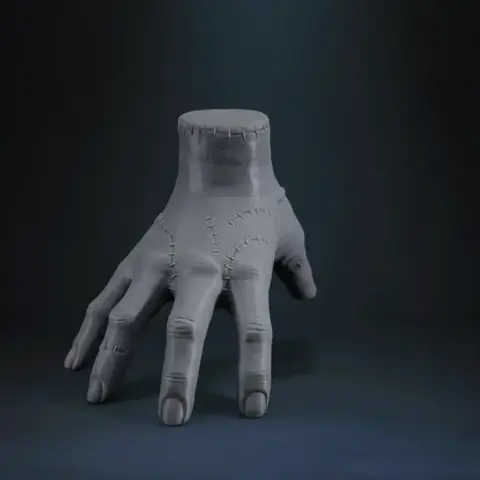 3D model of a stitched, disembodied hand in a crawling pose, capturing a spooky, macabre aesthetic.