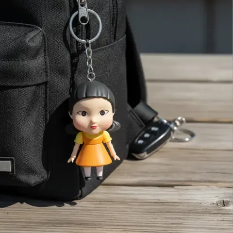 3D printable model of a stylized doll with a dress and headband, from a popular series.