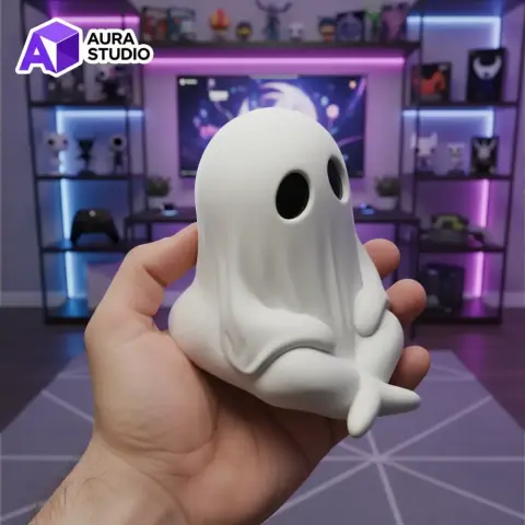 A cute, small ghost figurine with a draped sheet-like appearance and crossed legs.