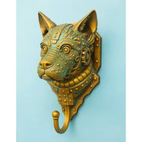 Steampunk-style dog head wall hook, metallic textures, bronze and teal tones.