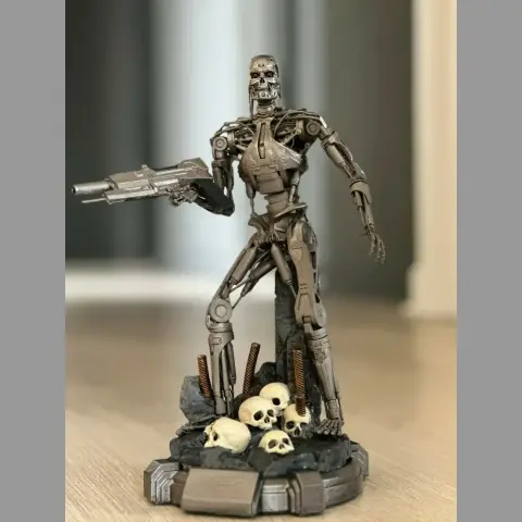 A detailed T-800 Terminator stands on a base with skulls, holding a gun, ready for action.
