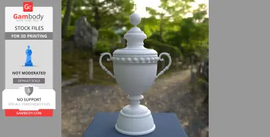 A 3D printable white trophy model with ornate handles and a spherical top, displayed outdoors.